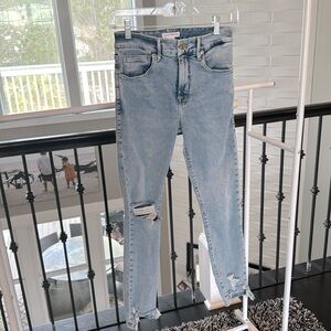 Good American distressed chewed hem skinny jeans